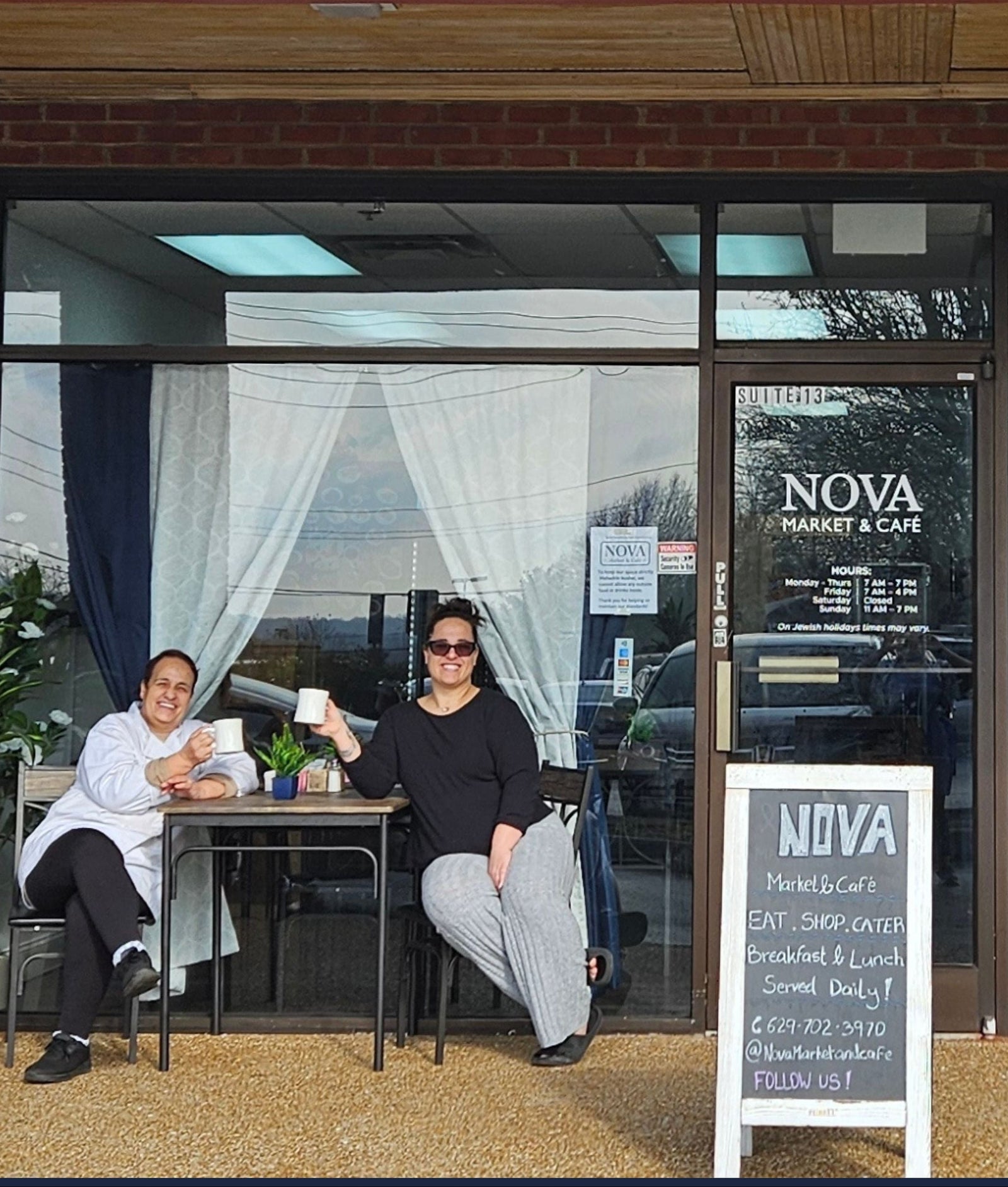 NOVA Market & Cafe with two people sitting outside
