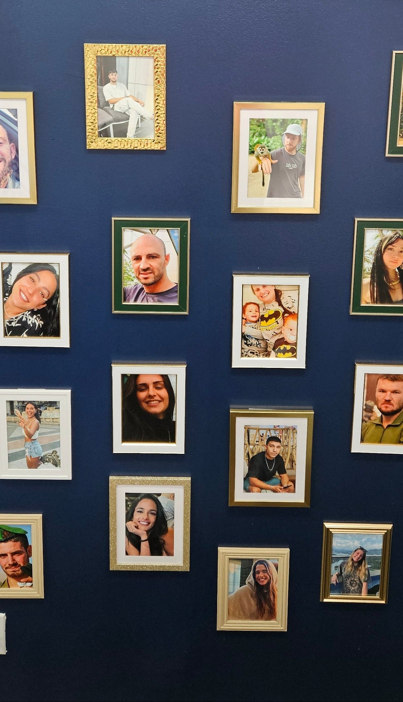 memorial Wall with decorative letters spelling 'NOVA' and framed pictures of murdered people from october 7th.